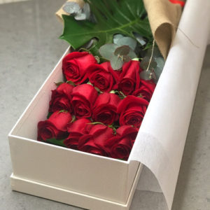 red roses in box arrangement